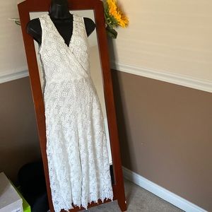 White lace sleeveless jumpsuit lined never wore size small